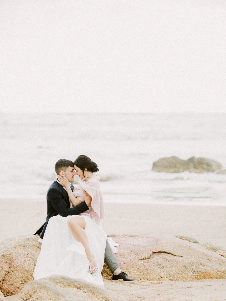 Bridal Couple on a beach rock - Porto Wedding Photographer